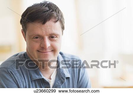 Stock Photo - Portrait of man with down syndrome. Fotosearch