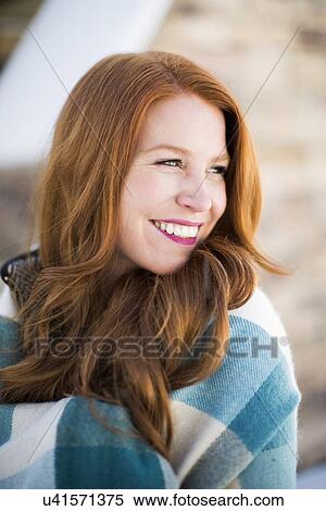Portrait of mid adult woman wrapped in checked blanket View Large Photo Image Stock Photography - Portrait of mid adult woman wrapped in checked blanket. Fotosearch