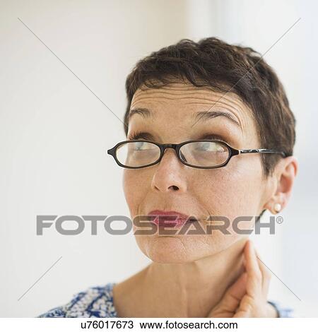 Portrait of senior woman wearing eyeglasses View Large Photo Image Stock Image - Portrait of senior woman wearing eyeglasses. Fotosearch