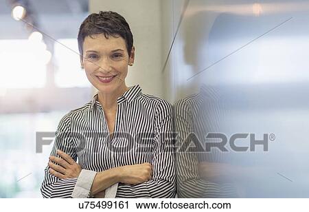 Portrait of smiling businesswoman View Large Photo Image Stock Image - Portrait of smiling businesswoman. Fotosearch