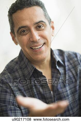 Stock Photo - Portrait of smiling mature man. Fotosearch