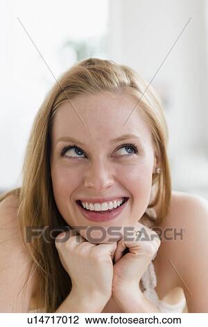 Portrait of smiling young woman View Large Photo Image Stock Image - Portrait of smiling young woman. Fotosearch