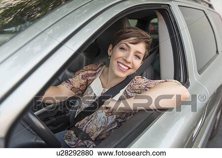 Portrait of woman in car View Large Photo Image Stock Image - Portrait of woman in car. Fotosearch