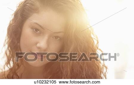 Stock Photography - Portrait of woman in sunlight. Fotosearch
