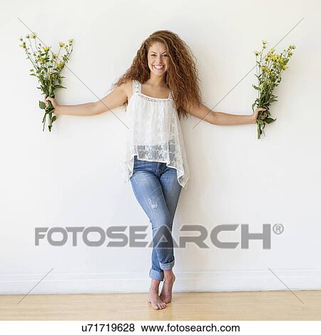 Portrait of woman with bunches of flowers in hands View Large Photo Image Stock Photo - Portrait of woman with bunches of flowers in hands. Fotosearch