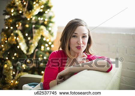 Portrait of woman with finger on lips View Large Photo Image Stock Photography - Portrait of woman with finger on lips. Fotosearch