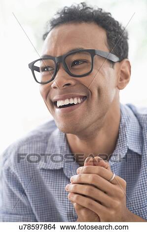 Picture - Portrait of young man smiling. Fotosearch