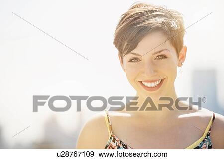 Stock Photo - Portrait of young smiling woman. Fotosearch