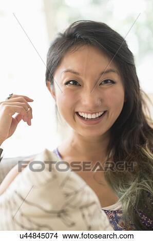 Portrait of young woman smiling View Large Photo Image Picture - Portrait of young woman smiling. Fotosearch