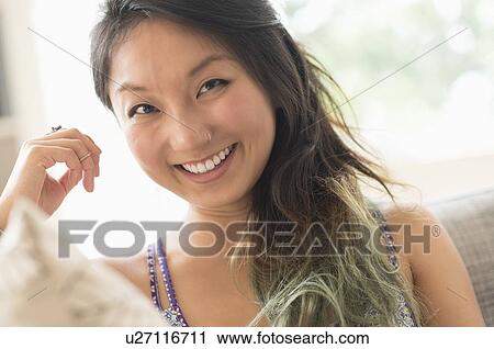 Portrait of young woman smiling View Large Photo Image Stock Image - Portrait of young woman smiling. Fotosearch