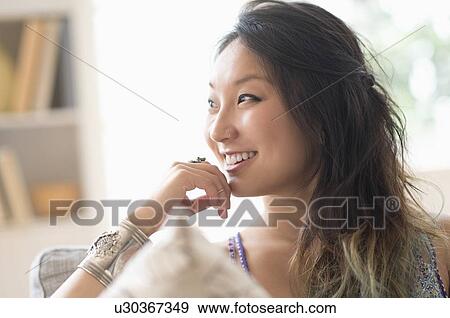 Portrait of young woman smiling View Large Photo Image Stock Photo - Portrait of young woman smiling. Fotosearch