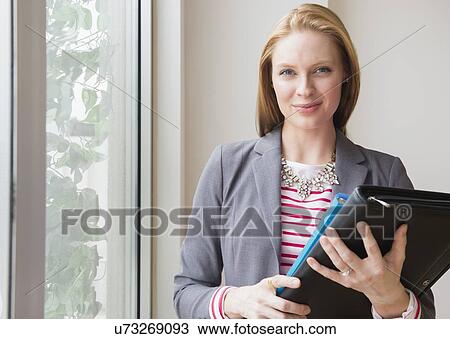 Stock Image - Portrait of young woman. Fotosearch
