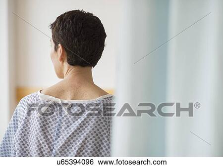 Rear view of senior woman wearing hospital gown View Large Photo Image Stock Photograph - Rear view of senior woman wearing hospital gown. Fotosearch