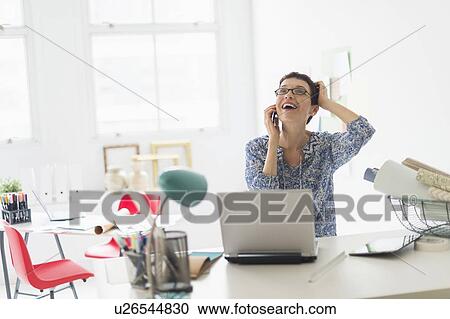 Senior business woman using cell phone in office View Large Photo Image Stock Image - Senior business woman using cell phone in office. Fotosearch