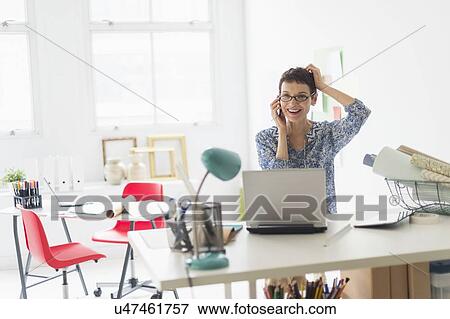 Senior business woman using cell phone in office View Large Photo Image Stock Photo - Senior business woman using cell phone in office. Fotosearch