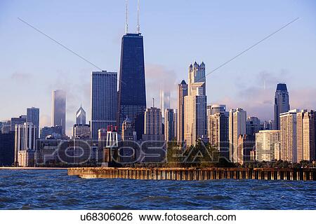 Stock Photograph - Skyscrapers and historical lighthouse seen from Lake Michigan. Fotosearch