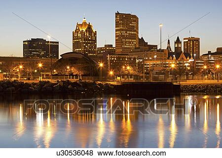 Stock Photo - Street lights reflecting in lake. Fotosearch