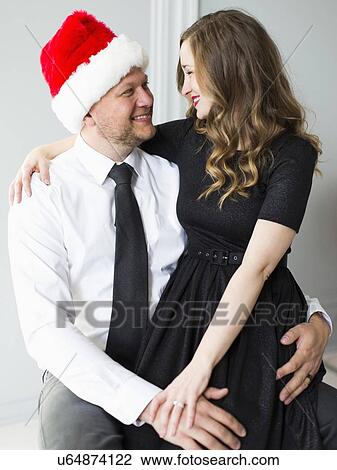 Studio portrait of young couple View Large Photo Image Stock Image - Studio portrait of young couple. Fotosearch