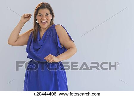 Studio shot of happy woman View Large Photo Image Stock Photograph - Studio shot of happy woman. Fotosearch