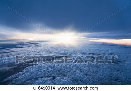 Sunrise over clouds View Large Photo Image Picture - Sunrise over clouds. Fotosearch