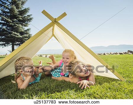 Three girls (2-3, 4-5) playing in tent View Large Photo Image Stock Image - Three girls (2-3, 4-5) playing in tent. Fotosearch