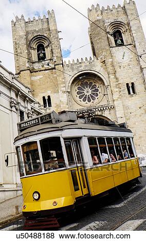 Tram in front of Lisbon Cathedral View Large Photo Image Stock Photo - Tram in front of Lisbon Cathedral. Fotosearch