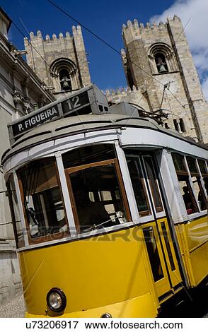 Stock Photo - Tram in front of Lisbon Cathedral. Fotosearch