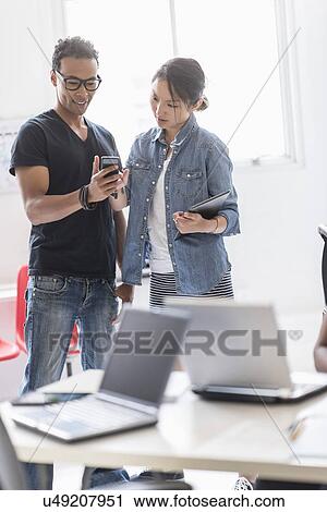 Stock Image - Woman and man in office. Fotosearch
