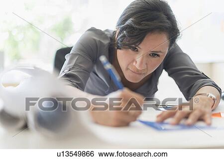 Woman drawing blueprints View Large Photo Image Stock Photograph - Woman drawing blueprints. Fotosearch
