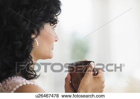 Woman enjoying her tea View Large Photo Image Stock Photo - Woman enjoying her tea. Fotosearch