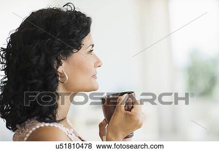 Woman enjoying her tea View Large Photo Image Stock Photo - Woman enjoying her tea. Fotosearch