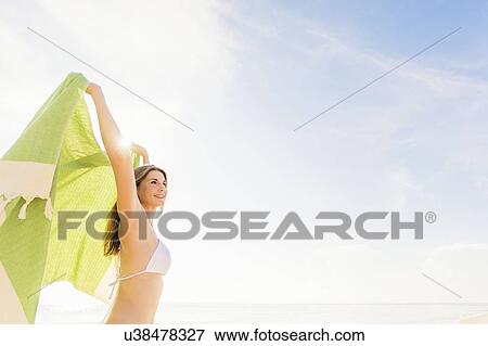 Woman holding green towel View Large Photo Image Stock Photo - Woman holding green towel. Fotosearch