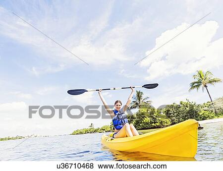 Stock Photo - Woman kayaking. Fotosearch