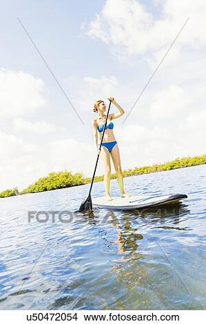 Woman on paddle board View Large Photo Image Picture - Woman on paddle board. Fotosearch