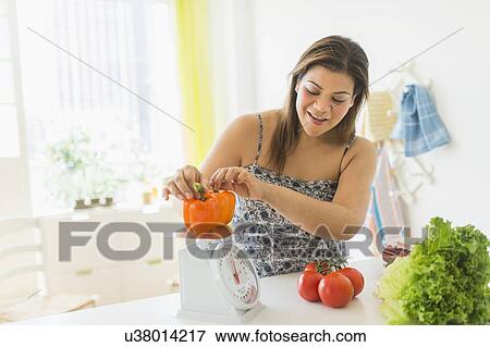 Woman preparing meal View Large Photo Image Stock Photo - Woman preparing meal. Fotosearch