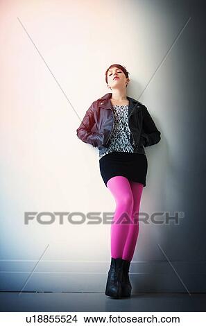 Woman wearing leather jacket, mini skirt and ping tights View Large Photo Image Picture - Woman wearing leather jacket, mini skirt and ping tights. Fotosearch