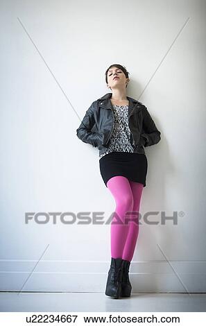 Woman wearing leather jacket, mini skirt and ping tights View Large Photo Image Stock Photo - Woman wearing leather jacket, mini skirt and ping tights. Fotosearch