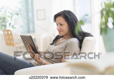Woman with digital tablet View Large Photo Image Stock Photo - Woman with digital tablet. Fotosearch