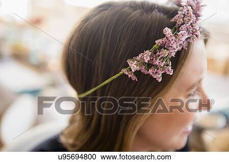 Woman with flowers on head View Large Photo Image Stock Image - Woman with flowers on head. Fotosearch