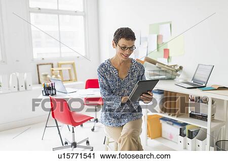 Woman working in home office View Large Photo Image Stock Image - Woman working in home office. Fotosearch