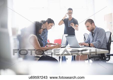 Women and men working in office View Large Photo Image Stock Image - Women and men working in office. Fotosearch