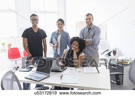 Women and men working in office View Large Photo Image Stock Photo - Women and men working in office. Fotosearch