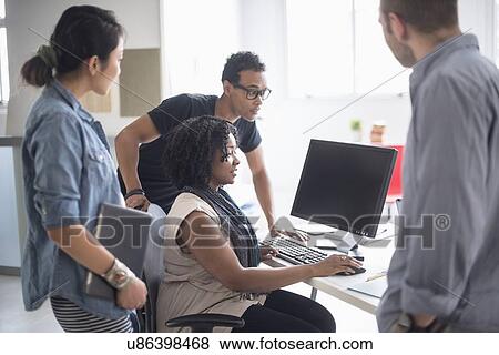 Women and men working in office View Large Photo Image Stock Photo - Women and men working in office. Fotosearch
