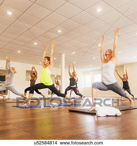 Women exercising yoga View Large Photo Image Picture - Women exercising yoga. Fotosearch