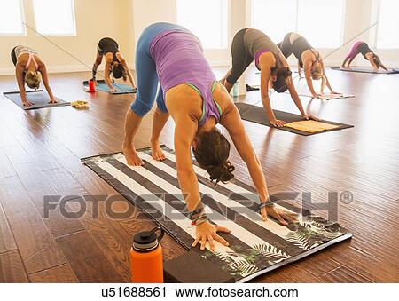 Women exercising yoga View Large Photo Image Stock Image - Women exercising yoga. Fotosearch