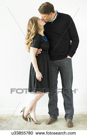 Stock Image - Young couple kissing. Fotosearch