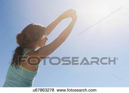 Young woman exercising View Large Photo Image Stock Photo - Young woman exercising. Fotosearch
