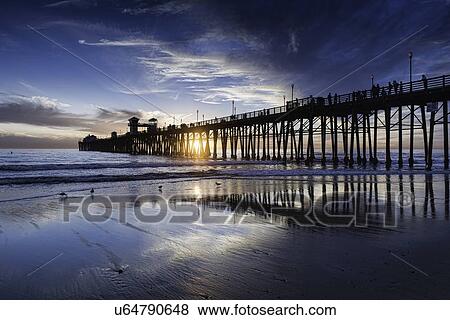 Stock Photo - Oceanside pier at sunset. Fotosearch