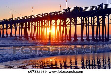 Stock Photo - Oceanside pier at sunset. Fotosearch