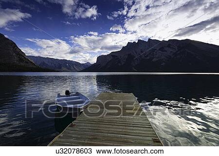 Stock Image - Pier on Lake Minnewanka. Fotosearch